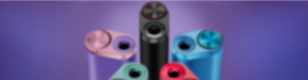 Seis dispositivos cilíndricos de varios colores están dispuestos en semicírculo, con un dispositivo negro en el centro. El fondo es morado. La imagen está intencionadamente borrosa.